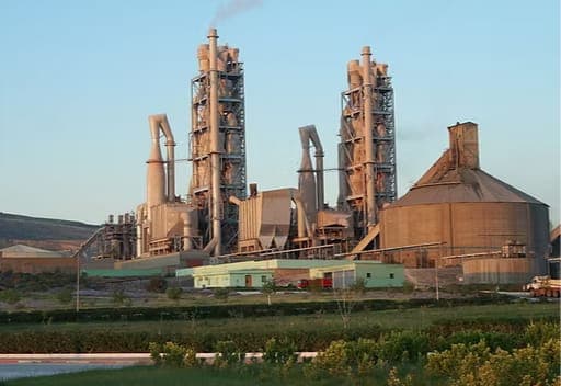 A cement plant with kiln towers and preheater